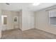 Well-lit bedroom featuring a window and an entryway to an ensuite bathroom and closet at 626 Green Rock Ct, Apopka, FL 32712