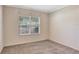 A bedroom with a window, neutral walls, and neutral carpeting at 626 Green Rock Ct, Apopka, FL 32712