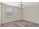 Bedroom with carpet, a ceiling fan, and a window providing natural light at 626 Green Rock Ct, Apopka, FL 32712