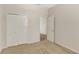 Cozy bedroom with neutral carpeting, closet, and a doorway leading to another room at 626 Green Rock Ct, Apopka, FL 32712