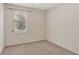 Bright bedroom featuring neutral carpet, baseboards, and a window for natural light at 626 Green Rock Ct, Apopka, FL 32712