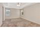Large carpeted room with two windows and a ceiling fan at 626 Green Rock Ct, Apopka, FL 32712
