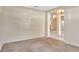 Open floor plan with neutral walls, carpeted floors, and arched doorway at 626 Green Rock Ct, Apopka, FL 32712