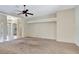 Spacious living room featuring neutral walls, carpeting, and ceiling fan at 626 Green Rock Ct, Apopka, FL 32712