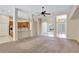Open-concept living area with view of kitchen and dining room with neutral walls and carpet at 626 Green Rock Ct, Apopka, FL 32712
