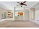 Open living space with carpet and a view of the kitchen and dining nook at 626 Green Rock Ct, Apopka, FL 32712
