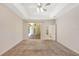 Spacious main bedroom with tray ceiling and sliding glass doors to the lanai at 626 Green Rock Ct, Apopka, FL 32712