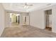 Spacious main bedroom with tray ceiling and sliding glass doors to the lanai at 626 Green Rock Ct, Apopka, FL 32712
