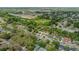 Wide aerial view of neighborhood featuring tree-lined streets and the property's proximity to local amenities at 6411 Merriewood Dr, Orlando, FL 32818