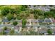 Aerial view of the property highlighting its location and surrounding neighborhood with mature trees for a serene environment at 6411 Merriewood Dr, Orlando, FL 32818