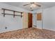 Bedroom with carpet flooring, closet, shelves, and neutral walls at 6411 Merriewood Dr, Orlando, FL 32818