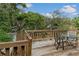 Outdoor deck featuring seating, a small table, and a natural view, ideal for relaxation and enjoying the surroundings at 6411 Merriewood Dr, Orlando, FL 32818