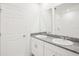 Bathroom showcasing dual sinks with granite countertops, modern fixtures, and tiled floors at 667 Pennywort St, Lake Alfred, FL 33850