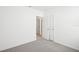 Bedroom features neutral carpet, a double-door closet, and fresh paint at 667 Pennywort St, Lake Alfred, FL 33850
