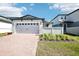 Charming single Gathering house with red brick driveway and a 2-car garage at 667 Pennywort St, Lake Alfred, FL 33850
