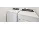 Close-up of modern, energy-efficient white Whirlpool washer and dryer at 667 Pennywort St, Lake Alfred, FL 33850