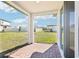 Covered patio featuring a brick-paved floor and a view of the backyard at 667 Pennywort St, Lake Alfred, FL 33850