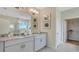 Elegant bathroom with double vanity, granite countertops, and a separate shower and tub at 7213 Nottingham Reel Ct, St Cloud, FL 34773