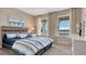 Inviting bedroom featuring a serene lake view, plush carpeting, and elegant decor, creating a peaceful retreat at 7213 Nottingham Reel Ct, St Cloud, FL 34773
