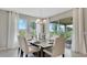 Bright dining room with large windows and access to the outdoor patio at 7213 Nottingham Reel Ct, St Cloud, FL 34773