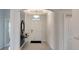 Bright entryway features neutral walls, an arched ceiling, decorative lighting and table at 7213 Nottingham Reel Ct, St Cloud, FL 34773