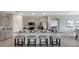 Bright kitchen featuring a granite island, stainless steel appliances, and bar seating perfect for entertaining guests at 7213 Nottingham Reel Ct, St Cloud, FL 34773