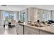 Open-concept kitchen flowing into the dining and living areas, ideal for modern living at 7213 Nottingham Reel Ct, St Cloud, FL 34773