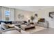 Comfortable living room with a large sectional sofa and stylish decor at 7213 Nottingham Reel Ct, St Cloud, FL 34773