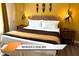 King-size bed in themed bedroom with safari decor and wood flooring at 8101 Resort Village Dr # 31501, Orlando, FL 32821