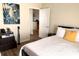 Bedroom with a zebra painting and a trunk as a nightstand at 8101 Resort Village Dr # 31501, Orlando, FL 32821
