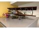 Close-up of two decorative vintage airplane models on a gray surface at 8101 Resort Village Dr # 31501, Orlando, FL 32821