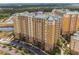 Luxury condo buildings with balconies, lush landscaping, and convenient parking at 8101 Resort Village Dr # 31501, Orlando, FL 32821