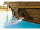 Water slide leading into a resort swimming pool at 8101 Resort Village Dr # 31501, Orlando, FL 32821