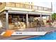 Poolside tiki bar with ample seating, televisions, and shaded seating at 8101 Resort Village Dr # 31501, Orlando, FL 32821