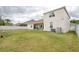 Large backyard with privacy fence and view of the home's exterior at 839 Timber Isle Dr, Orlando, FL 32828