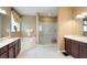 Bright bathroom with dual sink vanity, soaking tub and glass enclosed shower at 839 Timber Isle Dr, Orlando, FL 32828
