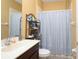 Standard bathroom with a white tub, shower, and single sink vanity at 839 Timber Isle Dr, Orlando, FL 32828
