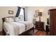 Bedroom featuring a comfortable bed, wood floors, and natural light at 839 Timber Isle Dr, Orlando, FL 32828
