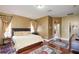 Bedroom featuring hardwood floors, area rugs, and warm colored walls at 839 Timber Isle Dr, Orlando, FL 32828