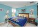 Comfortable bedroom featuring a wooden bed frame, side tables and decorative wall hangings at 839 Timber Isle Dr, Orlando, FL 32828