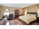 Spacious bedroom with hardwood floors, traditional decor, and ample natural light at 839 Timber Isle Dr, Orlando, FL 32828