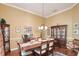 Traditional dining room featuring hardwood floors, crown molding, and elegant furnishings at 839 Timber Isle Dr, Orlando, FL 32828
