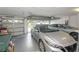 Well-lit two-car garage providing ample space for parking and storage with a traditional sectional garage door at 839 Timber Isle Dr, Orlando, FL 32828