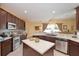 Kitchen area with stainless steel appliances, center island and a breakfast nook at 839 Timber Isle Dr, Orlando, FL 32828