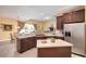 Bright kitchen features stainless steel appliances, an island, and dark wood cabinets at 839 Timber Isle Dr, Orlando, FL 32828