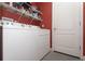 Well-equipped laundry room with a washer, dryer and shelving at 839 Timber Isle Dr, Orlando, FL 32828