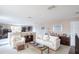 Cozy living room with plush seating, built in bookshelves, and natural light at 839 Timber Isle Dr, Orlando, FL 32828