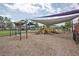 Large community playground featuring swings, slides, and shaded areas, perfect for outdoor activities and Gathering enjoyment at 839 Timber Isle Dr, Orlando, FL 32828