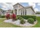 Beautiful front yard with lush landscaping, decorative stones, and mature trees at 839 Timber Isle Dr, Orlando, FL 32828