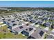 An aerial view of a residential neighborhood with modern homes and solar panels at 942 Jackson Ave, Davenport, FL 33837